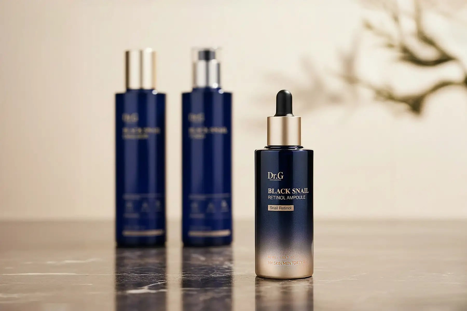 Dr. G Black Snail cosmetic set on elegant background