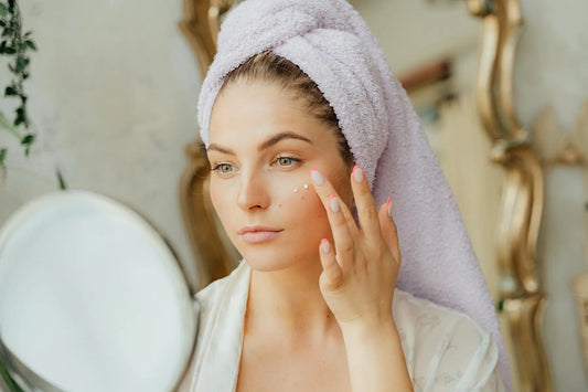 Woman applying face cream