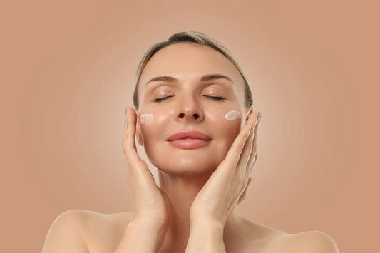 Woman enjoying serene skincare routine with relaxed expression